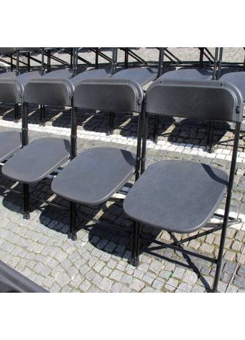 folding chairs on paving stone